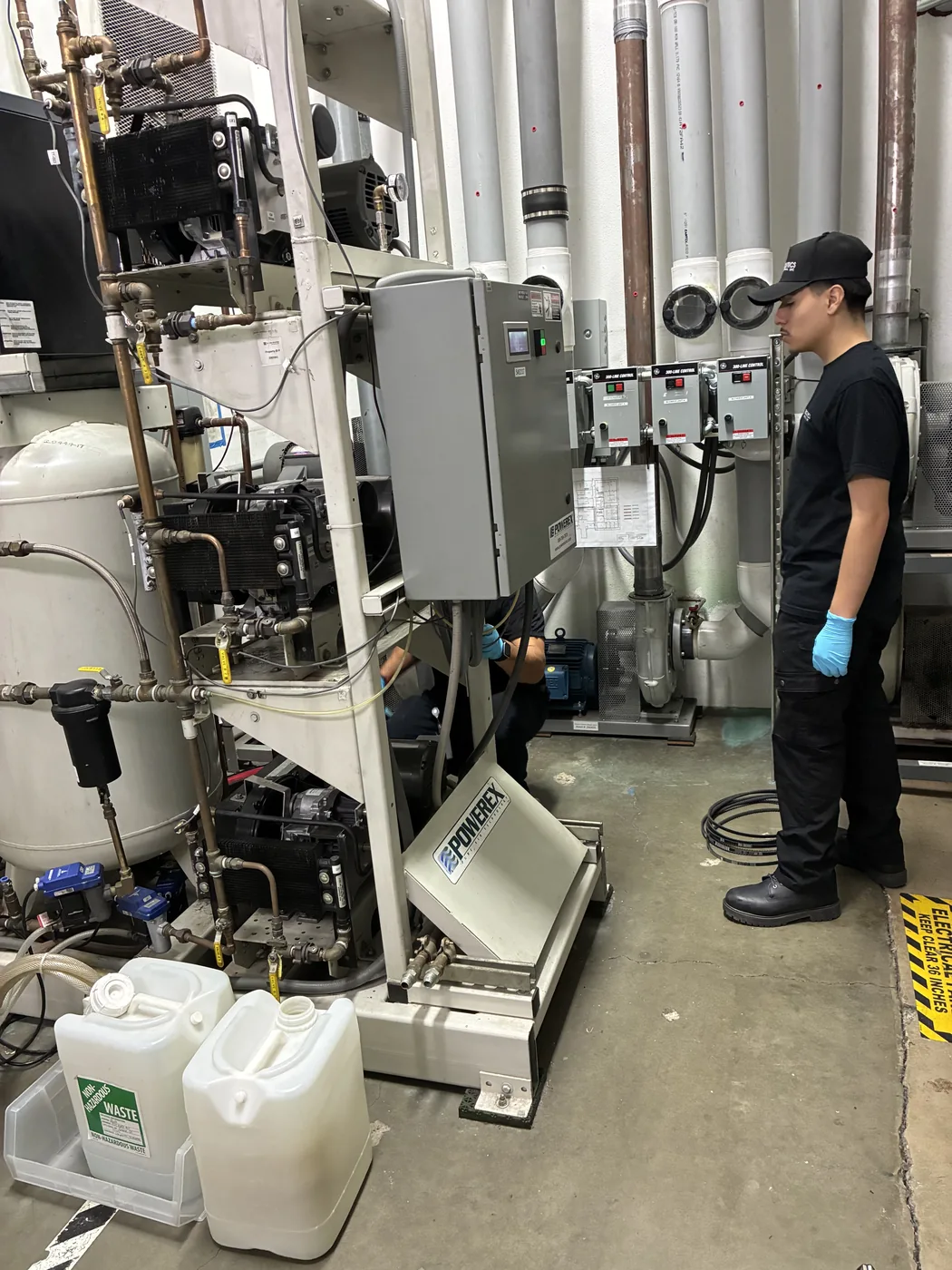 Toolytics technician inspecting industrial compressed-air equipment