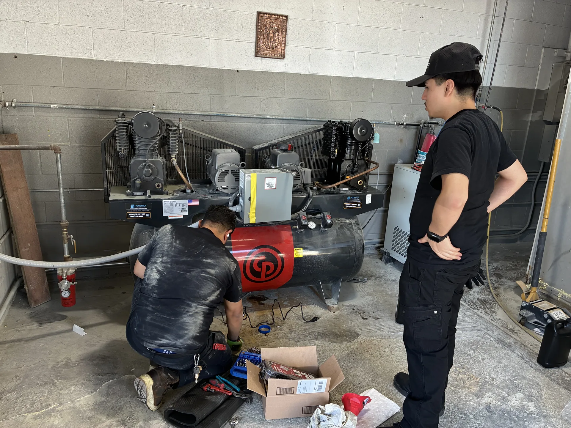 Toolytics Industrial team repairing a Chicago Pneumatic duplex compressor system