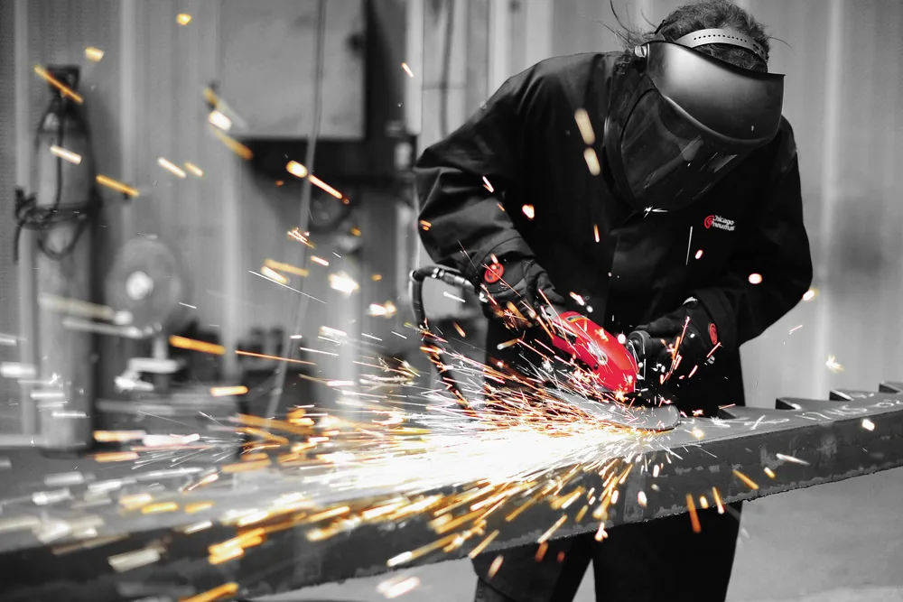 Operator dressing a weld with a Chicago Pneumatic angle grinder